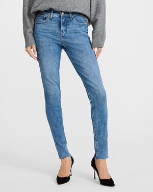 Mid Rise Medium Wash Raw Hem Skinny Jeans